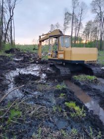 Odmulanie- pogłębianie , kopanie stawów skarpowanie